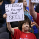 Los Angeles Clippers fan holds up signs referencing the Donald Sterling situation before Game 5 of the Western Conference Quarterfinals against the Golden State Warriors at the Staples Center April 29, 2014, in Los Angeles.
Stephen Dunn/Getty Images
